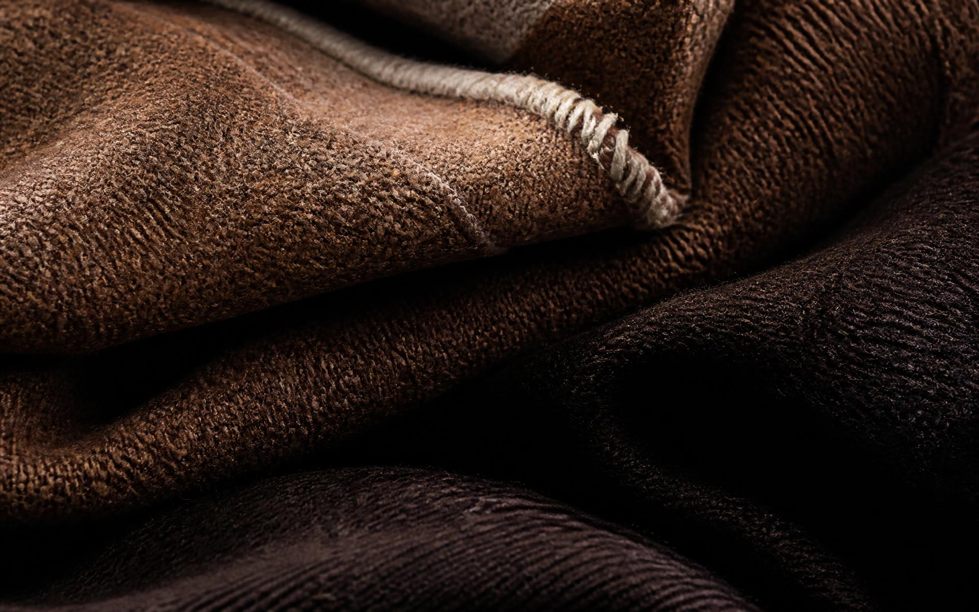 Close detail of folded camel and espresso wool fabric